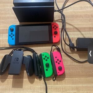Nintendo Switch Console with Neon Blue, Red, and Green Joy-Con